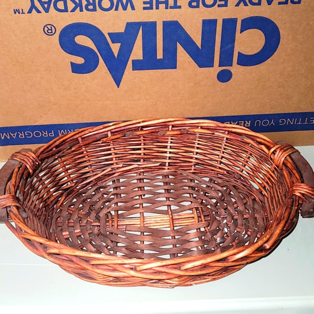 Wicker basket Gently loved cherry stain Approximately 15" by 10" 5" deep 9.8/10